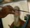 October 1971, Cyprus --- Father Stephanos, born in 1894, is one of the elderly monks who helps with the upkeep of the Monastery of Apostolos Varnavas in Barnavas, Cyprus by painting icons. | Location: Monastery of Apostolos Varnavas, Cyprus.  --- Image by © Jonathan Blair/CORBIS