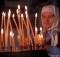 Photograph of elderly Russian woman in a babushka lighting prayer candles in a Russian Orthodox church in Russian Far East City of Sovetskaya Gavan
©Rich Frishman